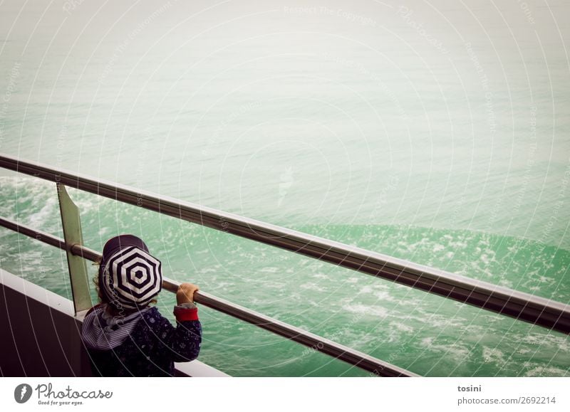 Child looking at the water from a ship Environment Turquoise Water Lake Ocean Far-off places Vantage point Cap rail Navigation Watercraft Boating trip Waves