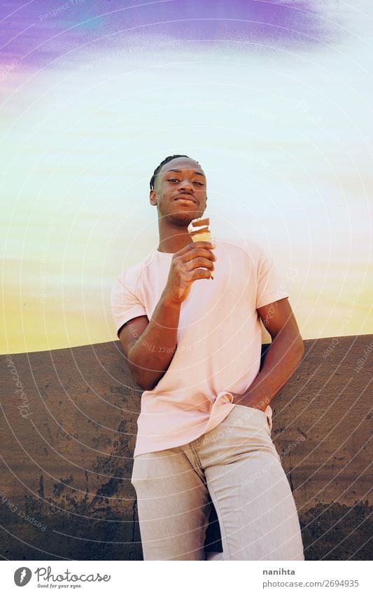 Young handsome man holds and eats a ice cream cone Ice cream Style Happy Summer Sunbathing Human being Masculine Man Adults Youth (Young adults) T-shirt Shirt