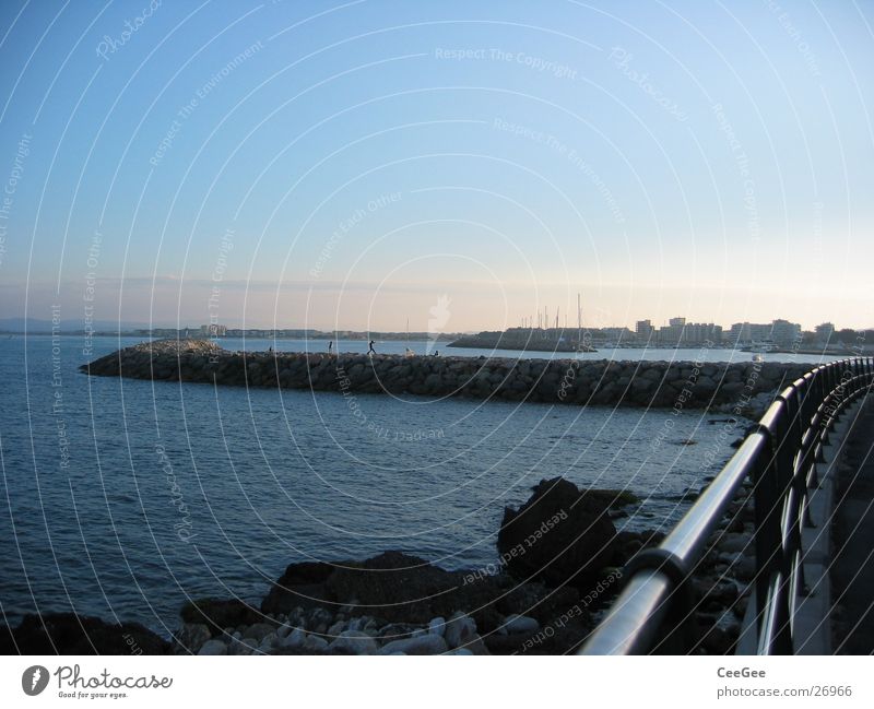 View to the harbour wall Wall (barrier) Jetty Light Exposure Twilight Ocean Spain Water Stone Fragment Rock Sun Harbour estartite Sky Blue Handrail Metal