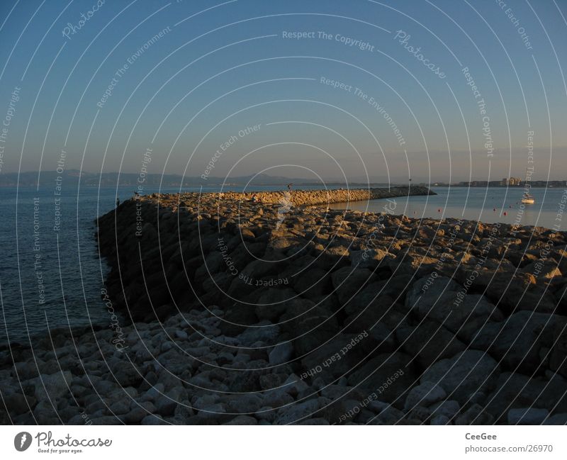 Harbour wall 2 Wall (barrier) Jetty Light Exposure Twilight Ocean Spain Water Stone Fragment Rock Sun estartite Sky Blue