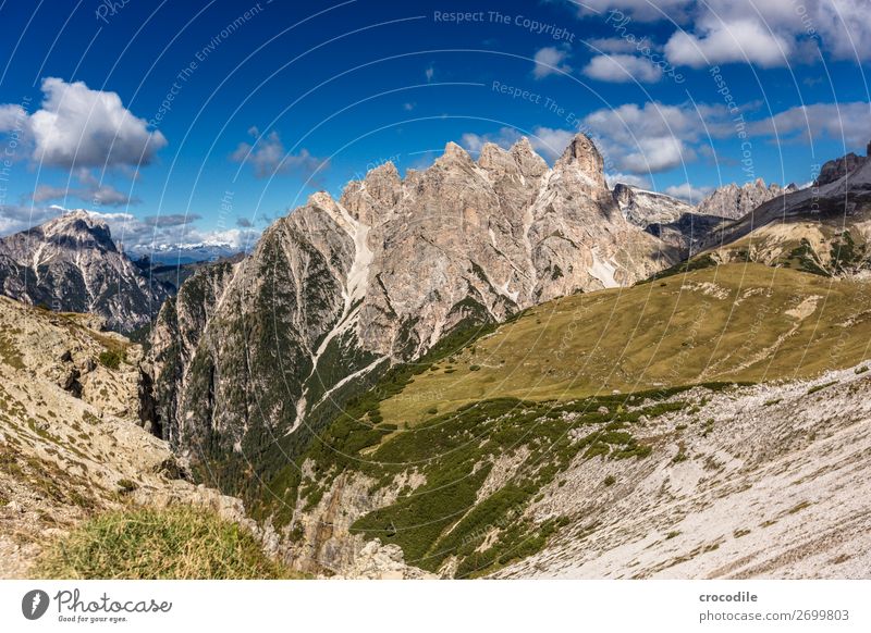 # 797 Three peaks Dolomites Sexten Dolomites World heritage High plain Colour photo Hiking Footpath Peak Mountaineering Alps Beautiful weather Meadow Summer Sun