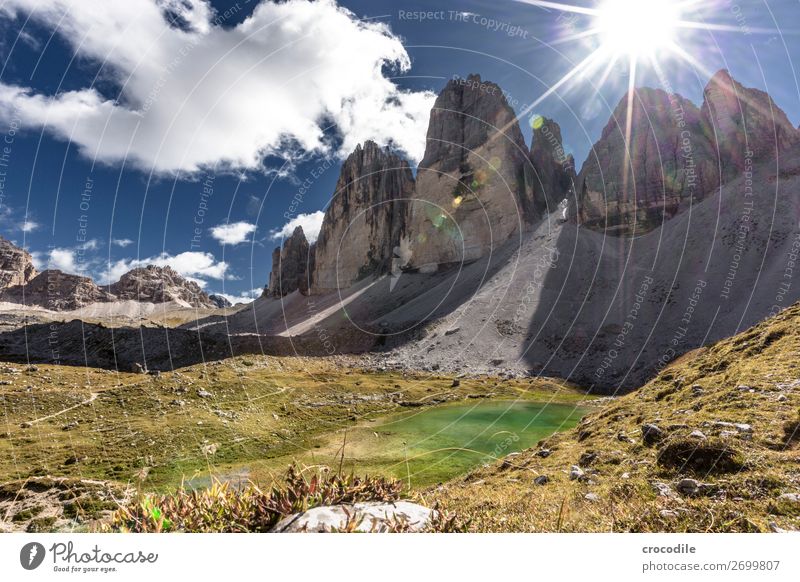 # 785 Three peaks Dolomites Sexten Dolomites World heritage High plain Colour photo Hiking Footpath Peak Mountaineering Alps Beautiful weather Meadow Summer Sun