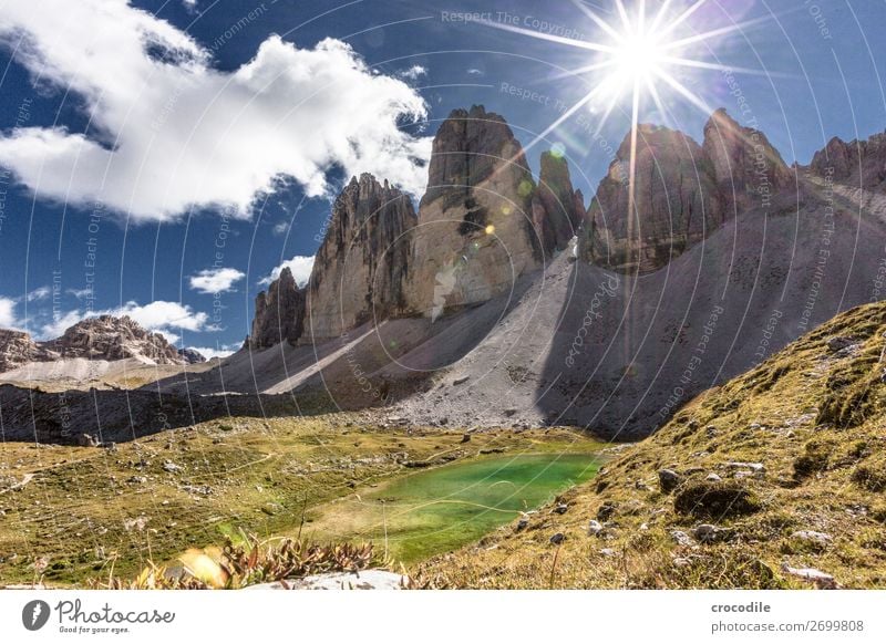 # 784 Three peaks Dolomites Sexten Dolomites World heritage High plain Colour photo Hiking Footpath Peak Mountaineering Alps Beautiful weather Meadow Summer Sun