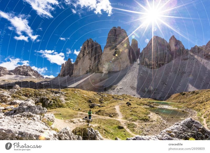 # 783 Three peaks Dolomites Sexten Dolomites World heritage High plain Colour photo Hiking Footpath Peak Mountaineering Alps Beautiful weather Meadow Summer Sun