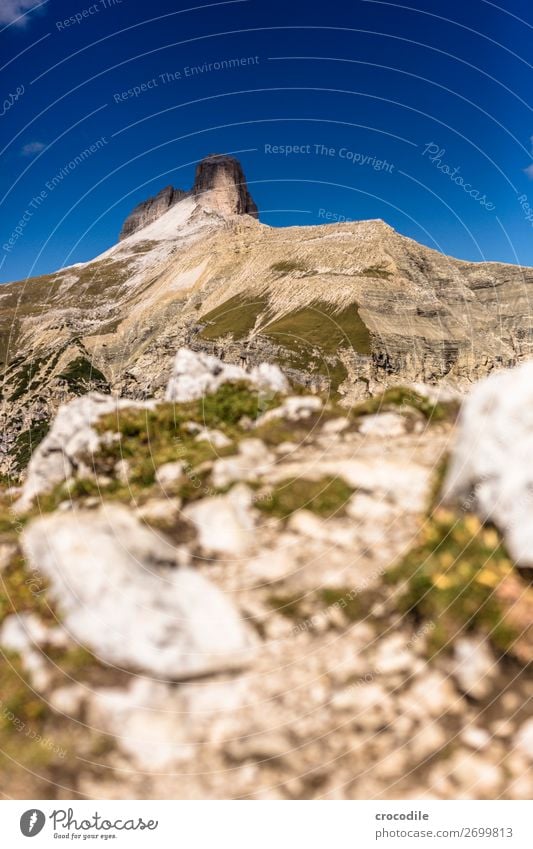 # 831 Three peaks Dolomites Sexten Dolomites World heritage High plain Colour photo Hiking Footpath Peak Mountaineering Alps Beautiful weather Meadow Summer Sun