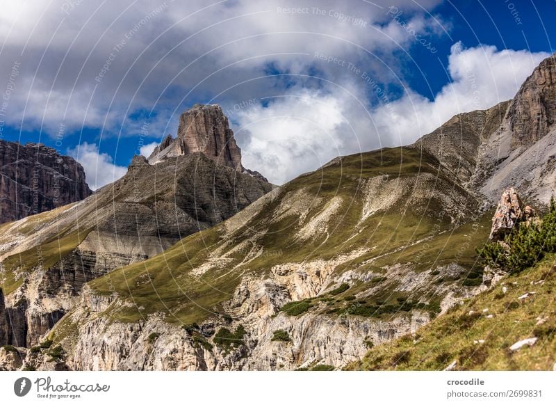 # 822 Three peaks Dolomites Sexten Dolomites World heritage High plain Colour photo Hiking Footpath Peak Mountaineering Alps Beautiful weather Meadow Summer Sun