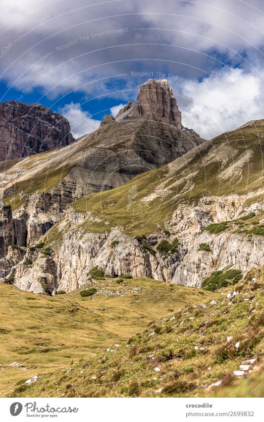 # 821 Three peaks Dolomites Sexten Dolomites World heritage High plain Colour photo Hiking Footpath Peak Mountaineering Alps Beautiful weather Meadow Summer Sun