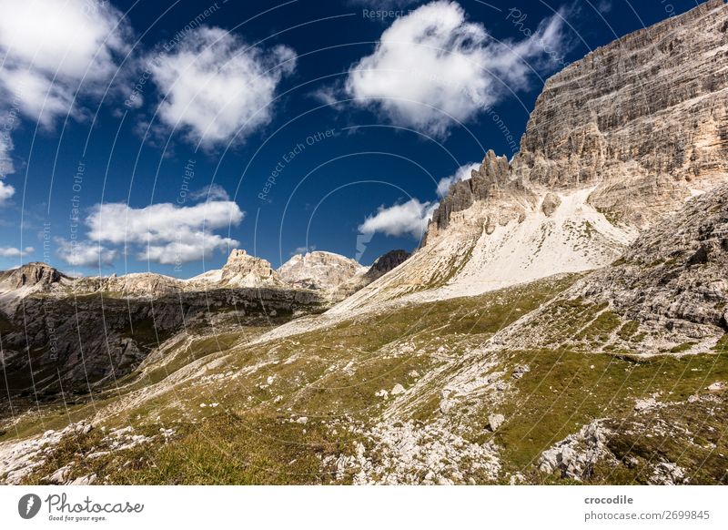 # 807 Three peaks Dolomites Sexten Dolomites World heritage High plain Colour photo Hiking Footpath Peak Mountaineering Alps Beautiful weather Meadow Summer Sun