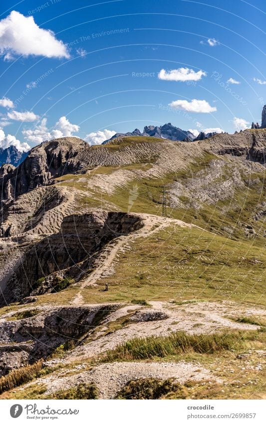 # 815 Three peaks Dolomites Sexten Dolomites World heritage High plain Colour photo Hiking Footpath Peak Mountaineering Alps Beautiful weather Meadow Summer Sun