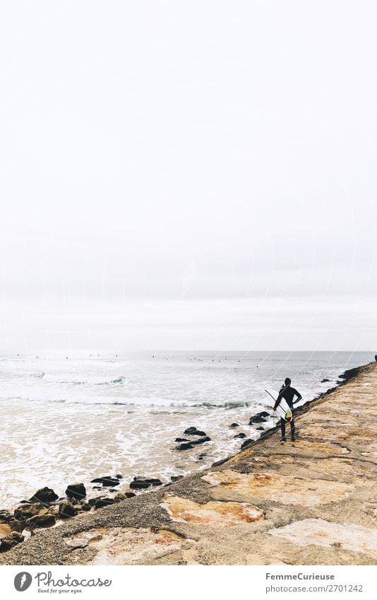 Surfer at the Atlantic Ocean 1 Human being Nature Movement Freedom Portugal Surfing Coast Sandy beach Swell Clouds Vacation & Travel Vacation mood