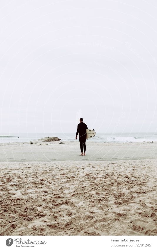 Surfer at the Atlantic Ocean Lifestyle 1 Human being Vacation & Travel Surfing Surfboard Sandy beach Freedom Clouds Sports Athletic Portugal Colour photo