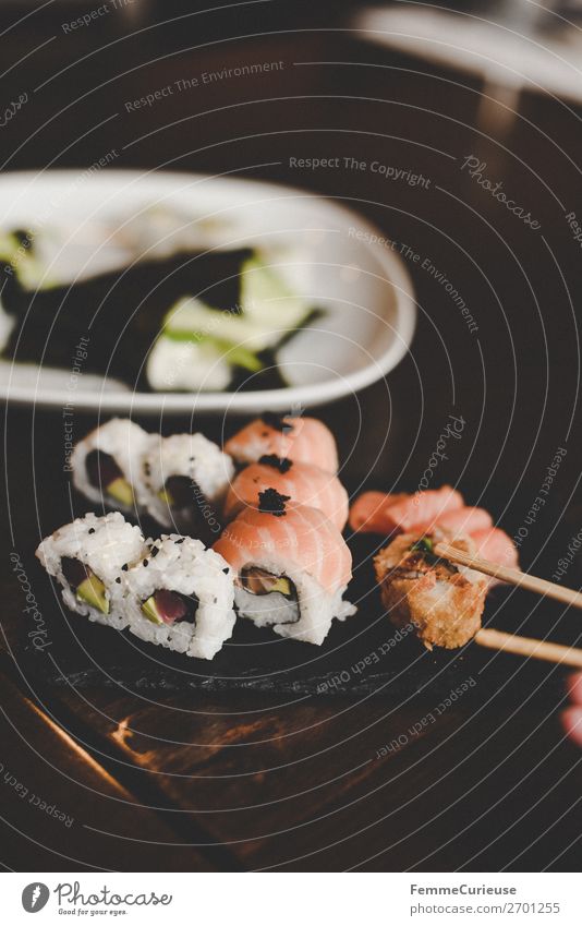 Sushi on black slate plate Food Fish Seafood Nutrition Lunch Dinner Buffet Brunch Organic produce To enjoy Salmon filet Rice Avocado Caviar Chopstick Slate