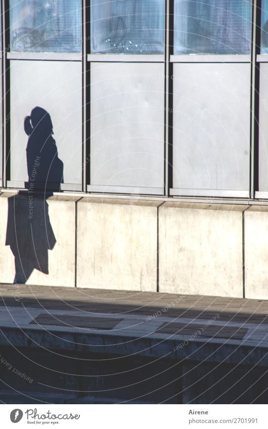 Buckled Feminine Woman Adults 1 Human being Train station Platform Concrete Glass Metal Stand Wait Blue Gray Boredom Stagnating Loneliness Broken Colour photo