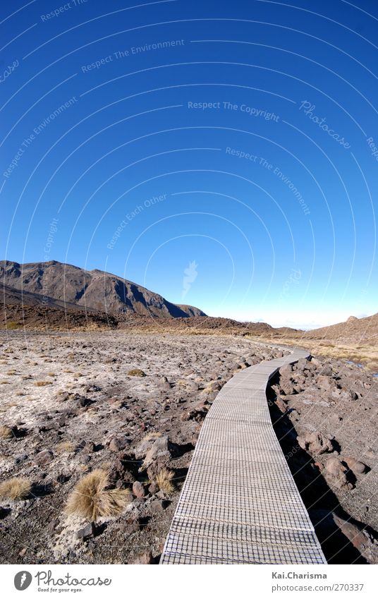 path Nature Landscape Earth Drought Field Hill Rock Mountain Hiking Dry Blue Brown Patient Calm Vacation & Travel Footpath Colour photo Exterior shot