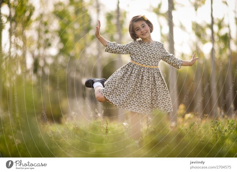 Little girl in nature field wearing beautiful dress Lifestyle Joy Happy Beautiful Playing Summer Child Human being Feminine Girl Woman Adults Infancy 1