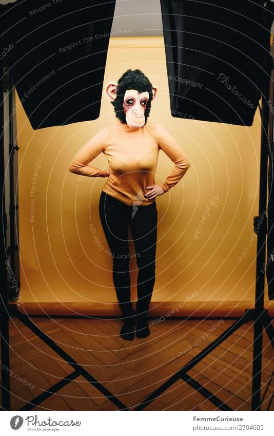 Woman with monkey mask posing in photo studio Feminine Adults 1 Human being 18 - 30 years Youth (Young adults) 30 - 45 years Joy Monkeys Chimpanzee Mask Pelt