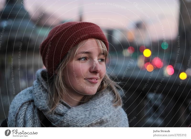 Woman with cap and scarf at the landing stages in the evening light Hamburg Port of Hamburg Town Balcony Scarf Cap Blonde Short-haired Bangs Smiling Looking