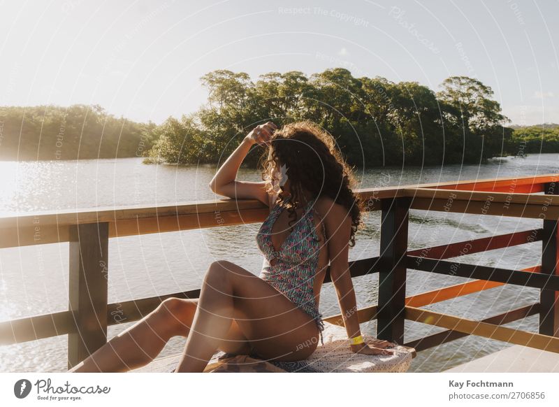 Young woman in a swimsuit looking out from the boat at mangrove bay Lifestyle Happy Harmonious Relaxation Leisure and hobbies Vacation & Travel Tourism Trip