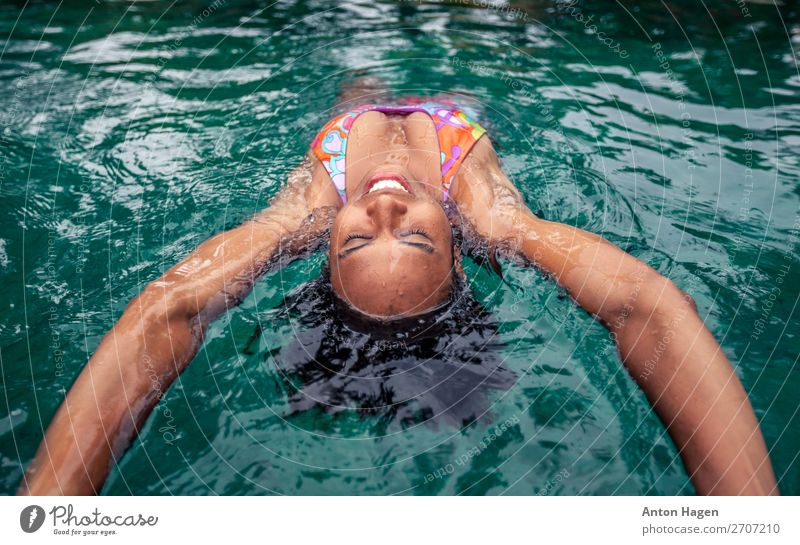 Young woman swimming on the back Lifestyle Healthy Athletic Harmonious Senses Relaxation Swimming pool Swimming & Bathing Human being Youth (Young adults) 1