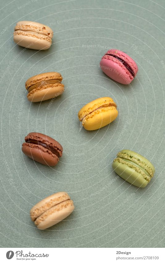 Above view of colorful macaroons on a marble background Dessert Gastronomy Fresh Bright Delicious Soft Yellow Green Colour Beaded Orange Purple appetizing