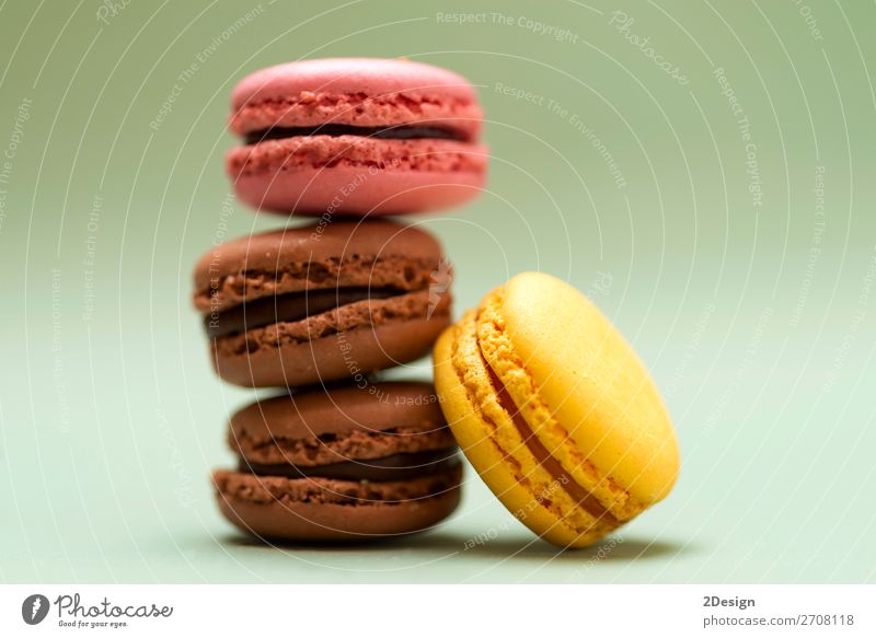 Front view of colorful macaroons on a marble background Dessert Gastronomy Fresh Bright Delicious Soft Yellow Green Colour Beaded Orange Purple appetizing