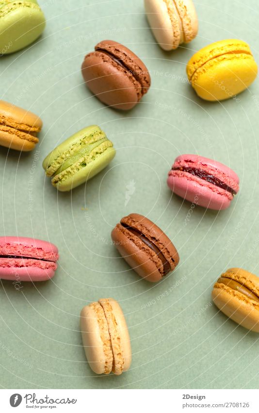 Above view of colorful macaroons on a marble background Dessert Gastronomy Fresh Bright Delicious Soft Yellow Green Colour Beaded Orange Purple appetizing