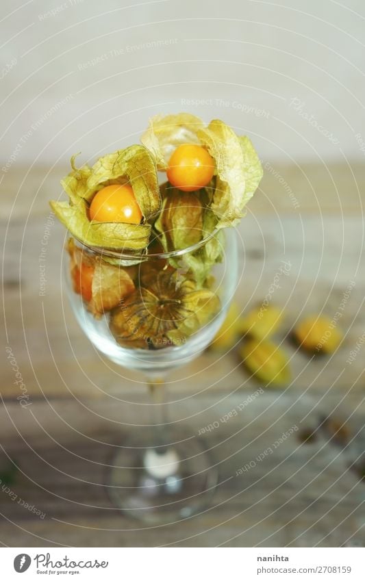 Beautiful and elegant macro close-up of a physalis Fruit Dessert Nutrition Organic produce Elegant Design Exotic Table Restaurant Plant Leaf Wood Simple