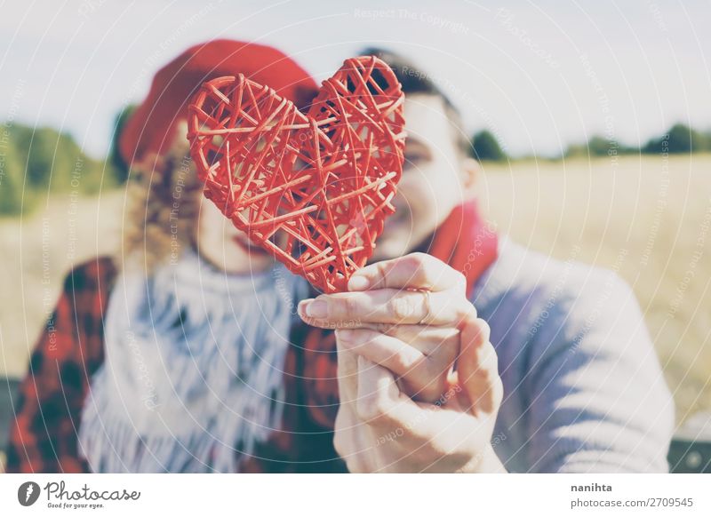 lose-up of a beautiful red heart held by a couple Lifestyle Happy Beautiful Healthy Wellness Sunbathing Feasts & Celebrations Valentine's Day Human being