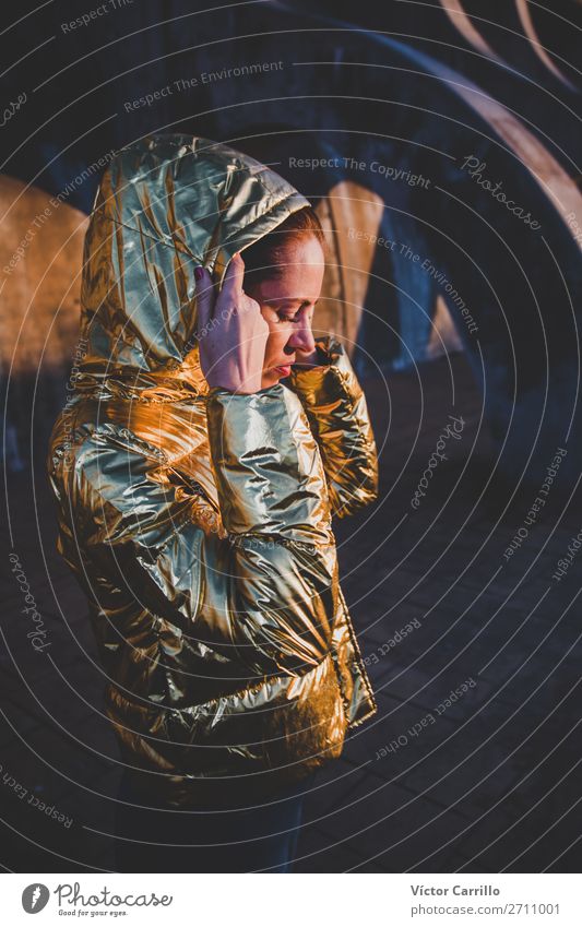 Young Woman in a sunset shooting with golden jacket Lifestyle Elegant Style Beautiful Face Human being Adults 1 Harbour Fashion Clothing Think Firm Free Fresh