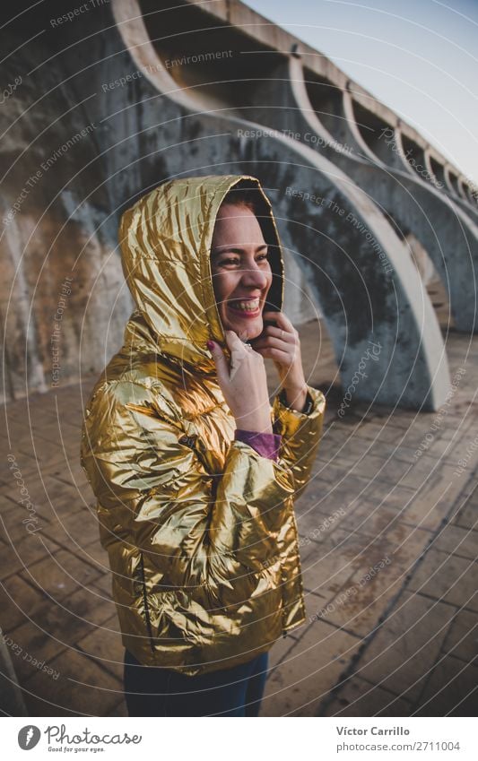 Young Woman smiling in a sunset shooting with golden jacket Lifestyle Elegant Style Feminine Young man Youth (Young adults) Adults Mother 1 Human being