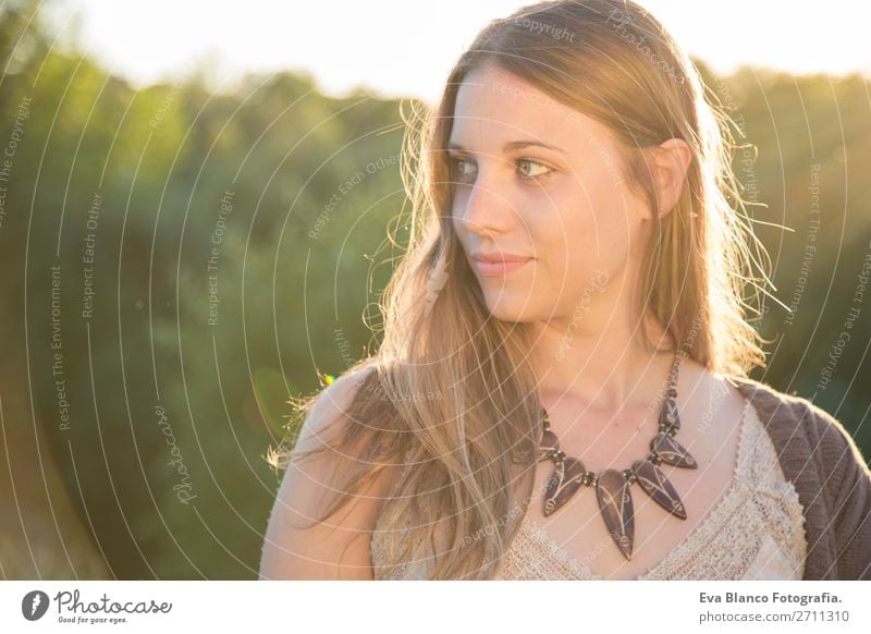 outdoors portrait of a beautiful young woman at sunset Lifestyle Joy Happy Beautiful Skin Face Relaxation Summer Sun Human being Woman Adults Hand Nature