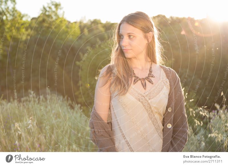 outdoors portrait of a beautiful young woman at sunset Lifestyle Joy Happy Beautiful Skin Face Relaxation Summer Sun Human being Woman Adults Hand Nature