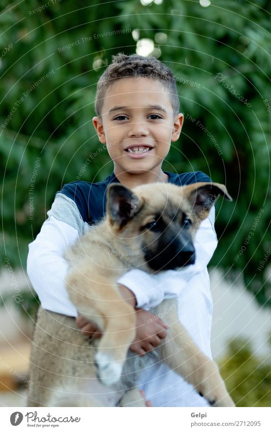 Latin child with his dog Lifestyle Joy Happy Face Relaxation Leisure and hobbies Child Human being Boy (child) Man Adults Family & Relations Friendship Infancy