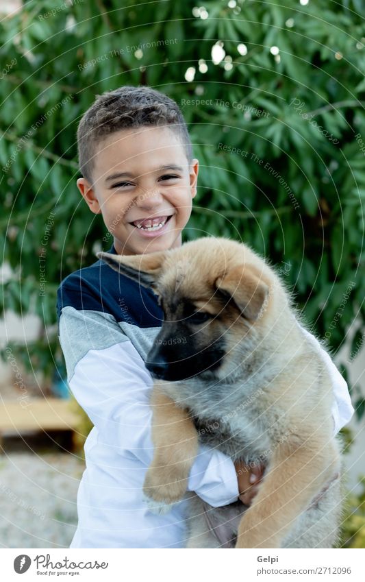 Latin child with his dog Lifestyle Joy Happy Face Relaxation Leisure and hobbies Child Human being Boy (child) Man Adults Family & Relations Friendship Infancy