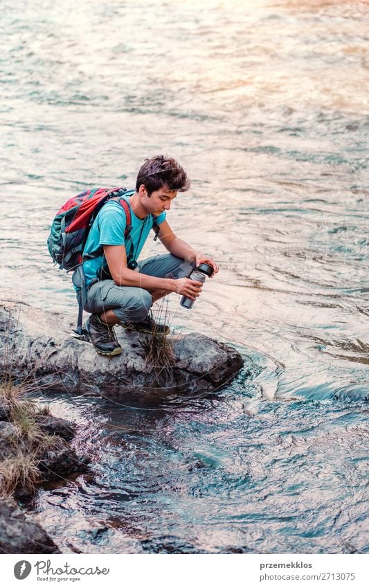 Young wanderer takes pure water from a river Body Life Vacation & Travel Tourism Trip Adventure Summer Hiking Human being Boy (child) Young man