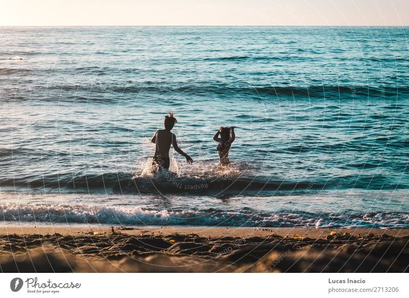 Couple Playing on the Beach at Sunset Cliffs, San Diego Vacation & Travel Tourism Trip Adventure Freedom Summer Summer vacation Ocean Waves Human being