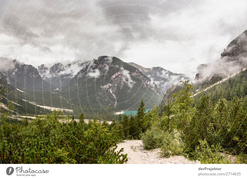 Braies Lake with clouds in the Dolomites XVIII Tourism Structures and shapes Copy Space bottom Vacation & Travel Light Copy Space right Shadow Contrast