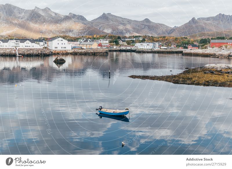 Small boat on lake Watercraft Lake Mountain Nature Sky Landscape Vacation & Travel Blue tranquil Tourism Beautiful Reflection Floating Peaceful Seasons