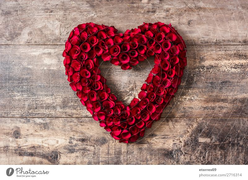 Heart made of red roses on wooden table for Valentine's Day. Love Mother's Day Rose Flower Symbols and metaphors Feasts & Celebrations Vacation & Travel