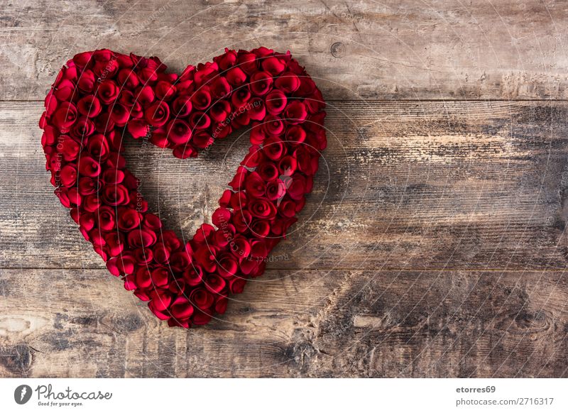 Heart made of red roses on wooden table for Valentine's Day. Love Mother's Day Rose Flower Symbols and metaphors Feasts & Celebrations Vacation & Travel