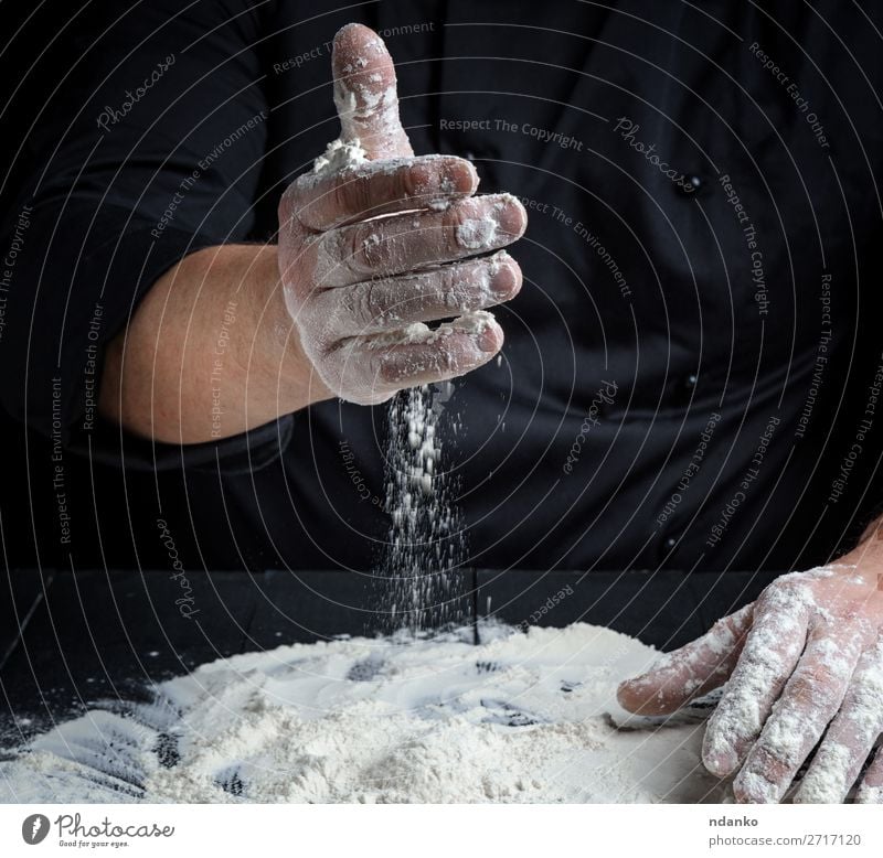 cook prepare to knead the dough Dough Baked goods Bread Table Kitchen Work and employment Cook Human being Hand Make Dark Fresh Wet Black White Baker Baking