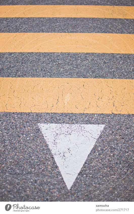 Across the street Town Downtown Deserted Transport Traffic infrastructure Motoring Pedestrian Street Road sign Sign Signs and labeling Going Yellow Gray