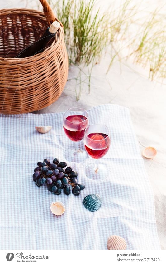 Two wine glasses, grapes, wicker basket on beach Food Fruit Picnic Beverage Alcoholic drinks Wine Champagne Bottle Champagne glass Beautiful Relaxation