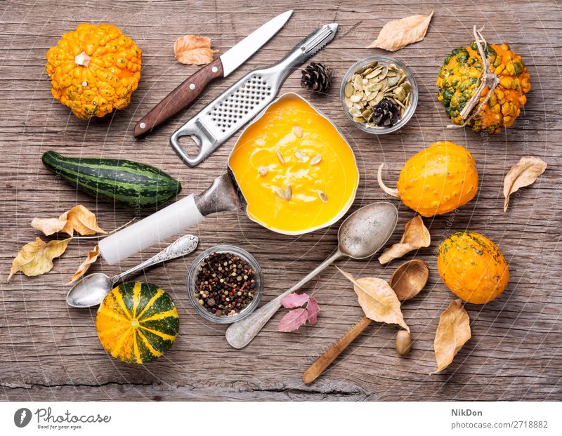 Seasonal pumpkin soup vegetable squash food autumn vegetarian healthy bowl cream pan saucepan pot casserole cooker yellow healthy food traditional symbolic