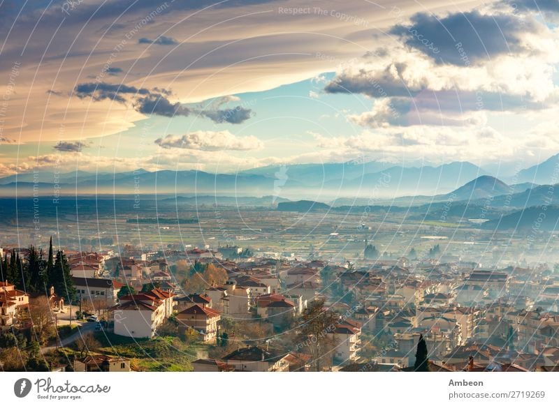 Greek town evening panorama with red roof houses, valley and mountains in the background, Kalambaka, Thessaly, Greece Kalabaka autumn beautiful building church