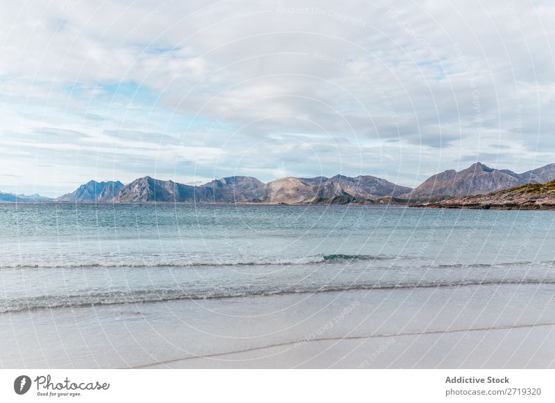 Waves and view to hills Coast Lake Water Hill Mountain Peak Nature Vacation & Travel Vantage point Picturesque Slagheap Landscape Height Rock Adventure