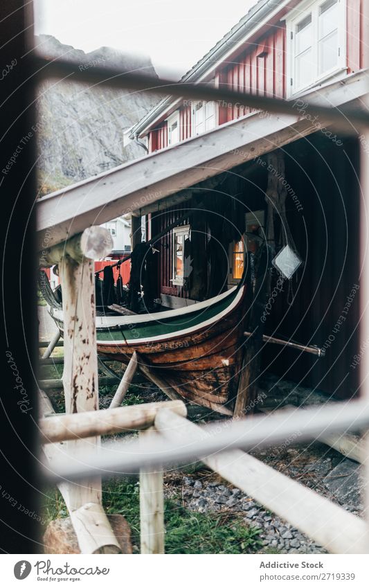 Boat under roof Watercraft Roof Village Fishery House (Residential Structure) Old Mountain Shabby Vacation & Travel Building Wood Timber Transport Vessel Shed