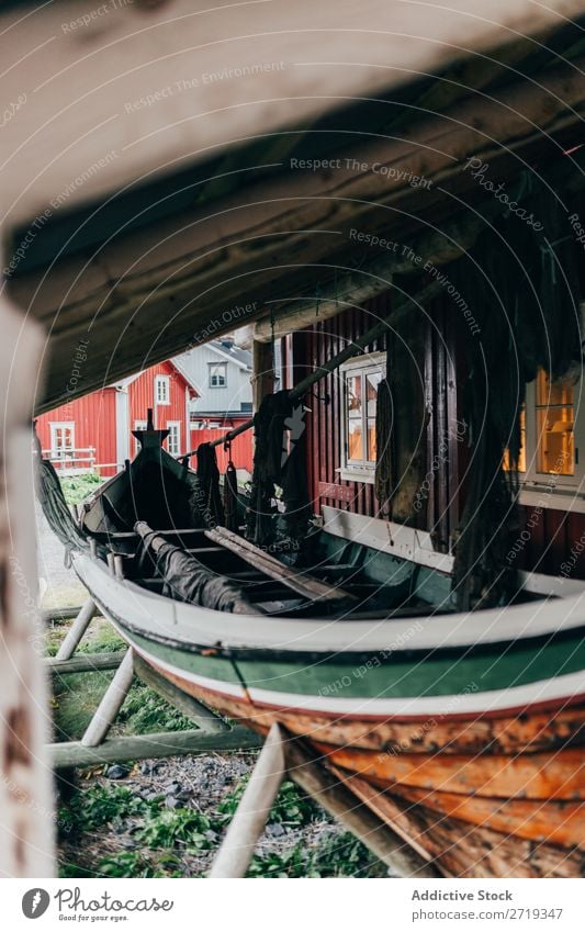 Fishing boat under roof Watercraft Roof Village Net Fishery House (Residential Structure) Old Shabby Vacation & Travel Building Wood Timber Transport Vessel