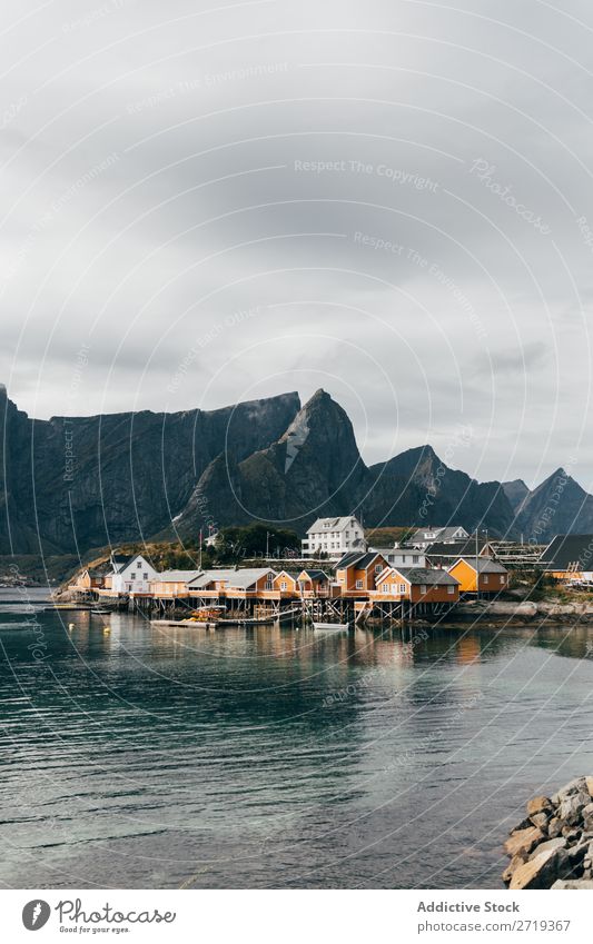 Houses on lake shore Lake Village Mountain Nature Landscape House (Residential Structure) breathtaking Water Coast Sky Vantage point Majestic Calm Peak