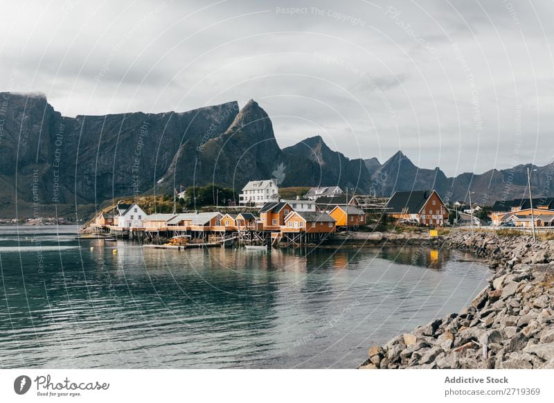 Houses on lake shore Lake Village Mountain Nature Landscape House (Residential Structure) breathtaking Water Coast Sky Vantage point Majestic Calm Peak